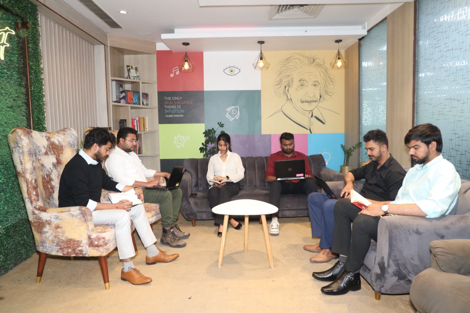 Team members working from the Resourcifi office lounge