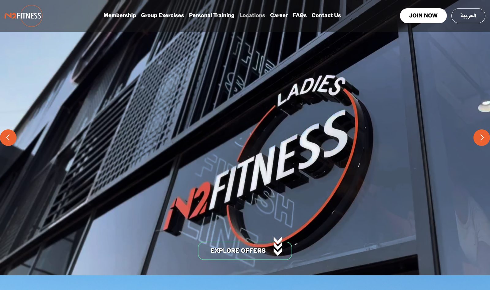 IN2 Fitness homepage with a cinematic brand hero over the Ladies Fitness club signage and a Join Now call to action
