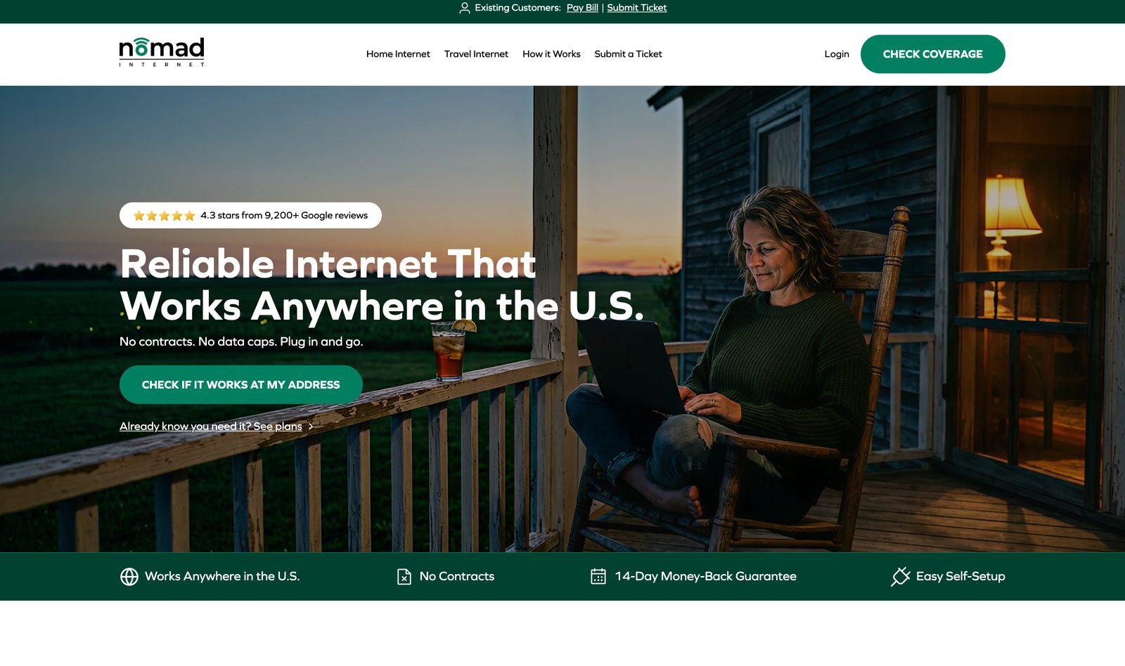 Nomad Internet homepage hero reading Reliable Internet That Works Anywhere in the U.S. with a person on a porch, a no-contracts and 14-day money-back trust strip, and a Check Coverage button