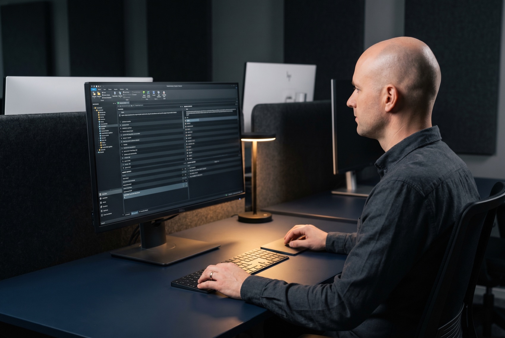 A senior localization lead reviewing a multi-market translation workspace and a per-market query backlog