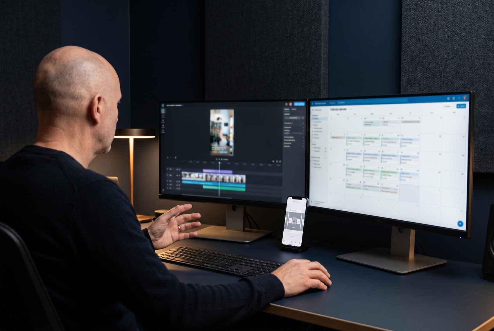 A senior content producer reviewing an editorial calendar and a vertical-video edit